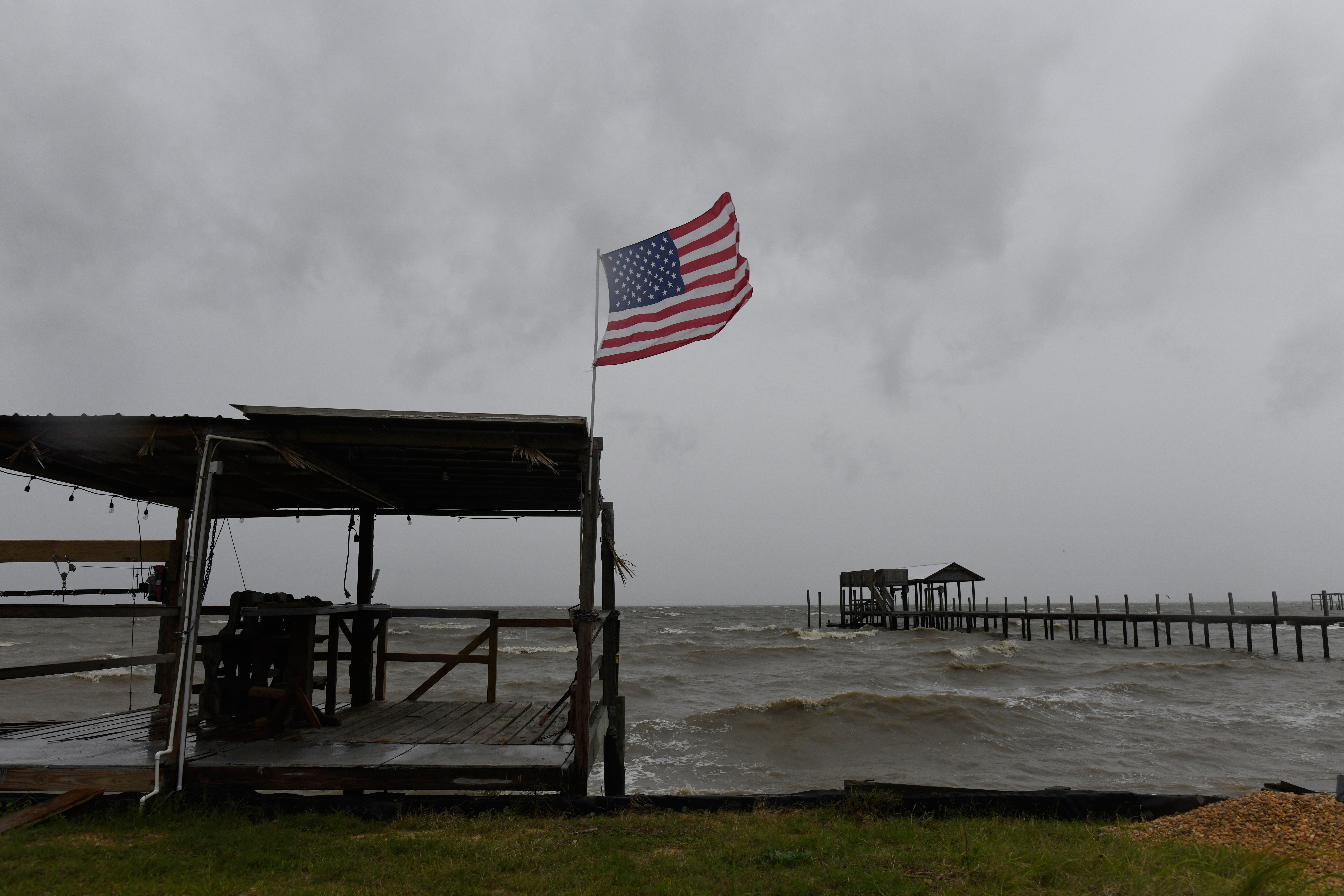 Isaias weakens but flooding threat persists as hundreds of thousands grapple with power outages Image